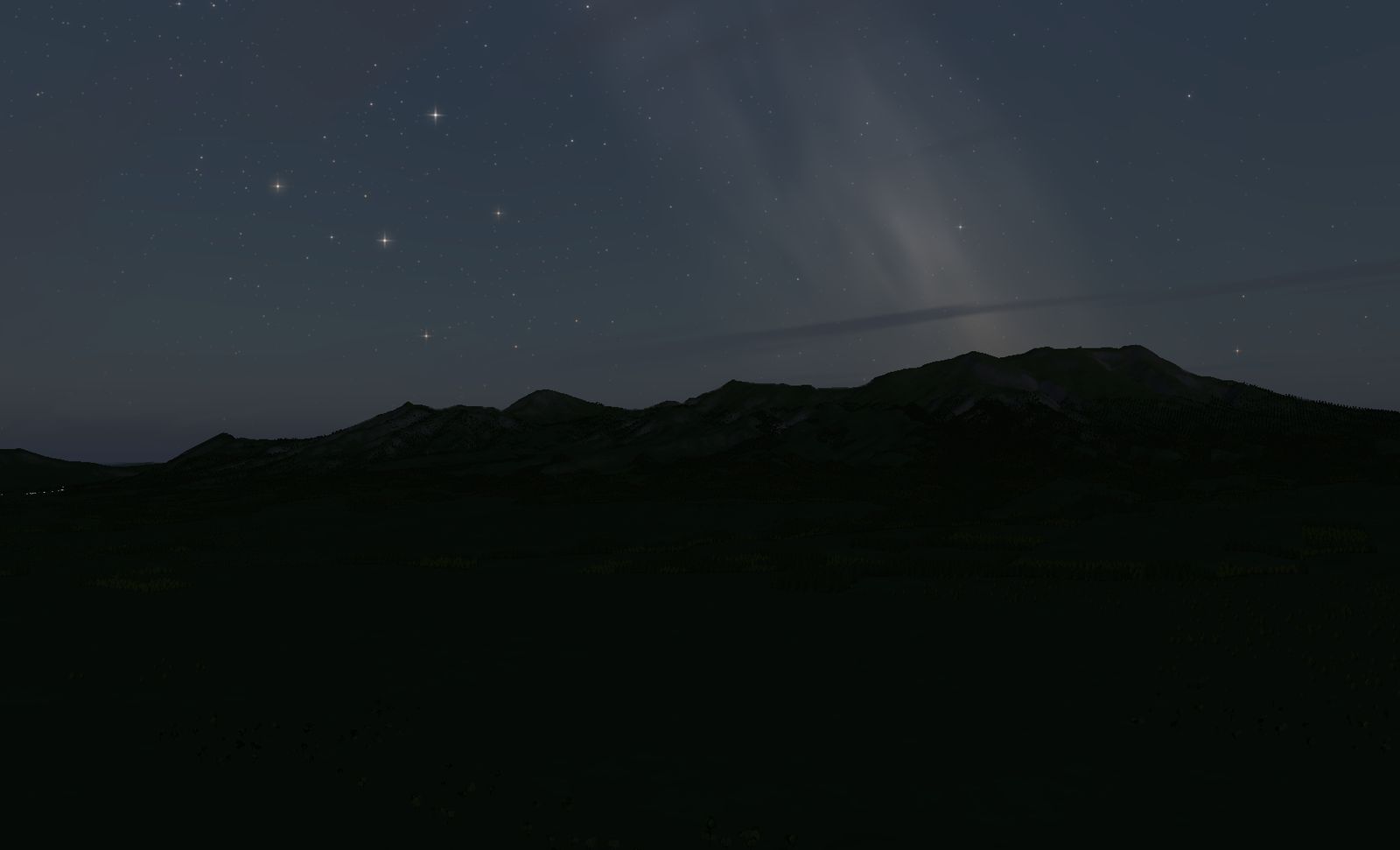 星空の下の阿蘇。手前のカルデラ床は暗く沈み、正面に外輪山と中央火口丘の稜線が黒く横たわる